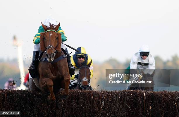 Barry Geraghty riding Pendra clear the last to win The Sodexo Gold Cup Handicap Steeple Chase at Ascot racecourse on October 31, 2015 in Ascot,...