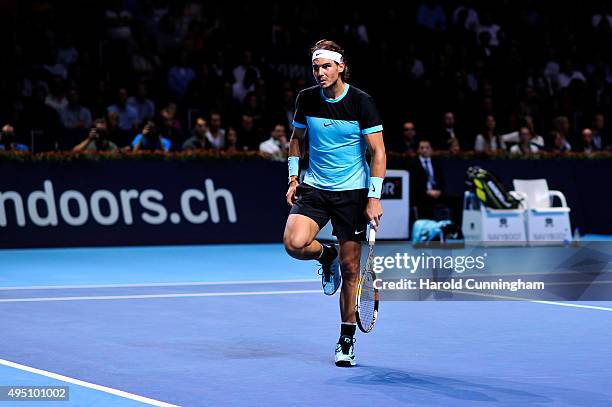 Rafael Nadal of Spain checks his knee during the sixth day of the Swiss Indoors ATP 500 tennis tournament against Richard Gasquet of France at St...