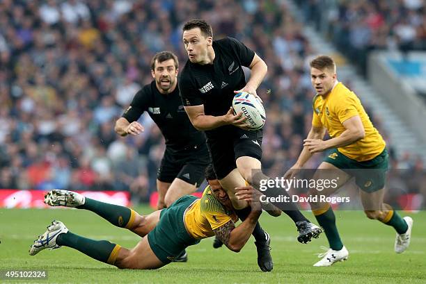 Ben Smith of New Zealand is tackled by Israel Folau of Australia during the 2015 Rugby World Cup Final match between New Zealand and Australia at...