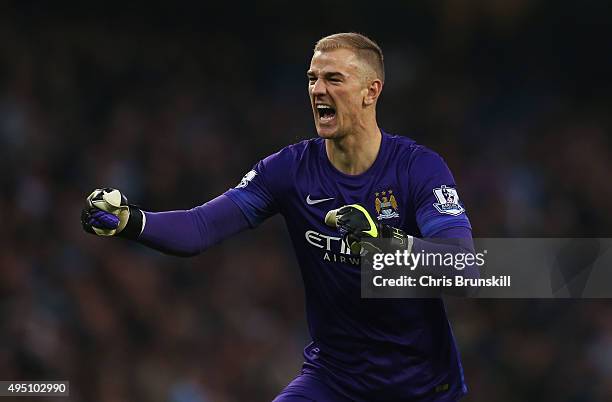 Joe Hart of Manchester City celeberate his team's first goal by Nicolas Otamendi during the Barclays Premier League match between Manchester City and...