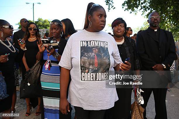 Shakra Waters wears a shirt that reads, 'In loving memory of Corey Jones,' as she waits for the start of the funeral for Corey Jones at the Payne...