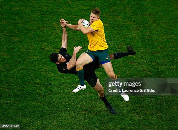 Drew Mitchell of Australia claims the high ball under pressure from Nehe Milner-Skudder of the New Zealand All Blacks during the 2015 Rugby World Cup...