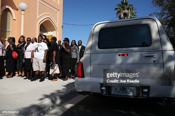 Hearse arrives as mourners wait to attend the funeral of Corey Jones at the Payne Chapel AME church on October 31, 2015 in West Palm Beach, Florida....