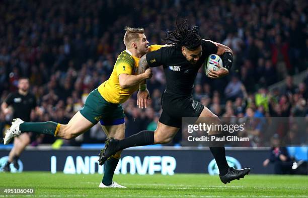 Ma'a Nonu of New Zealand breaks the tackle of Drew Mitchell of Australia on his way to score his team's second try during the 2015 Rugby World Cup...