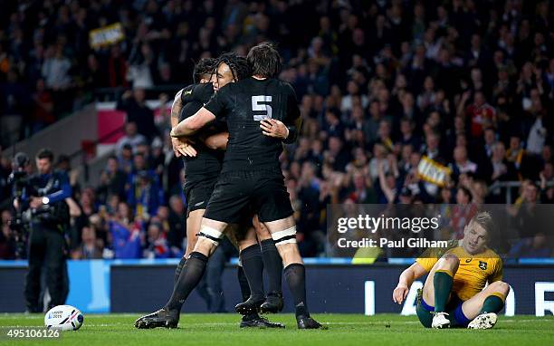 Ma'a Nonu of New Zealand celebrates scoring his team's second try with Sam Whitelock of New Zealand and Julian Savea of New Zealand during the 2015...