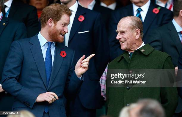 Prince Harry and Prince Phillip enjoy the atmosphere during the 2015 Rugby World Cup Final match between New Zealand and Australia at Twickenham...