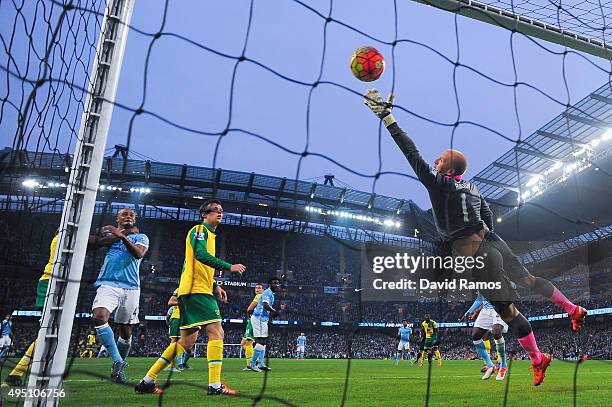 Goalkeeper John Ruddy of Norwich City fails to stop Nicolas Otamendi of Manchester City from scoring their first goal during the Barclays Premier...