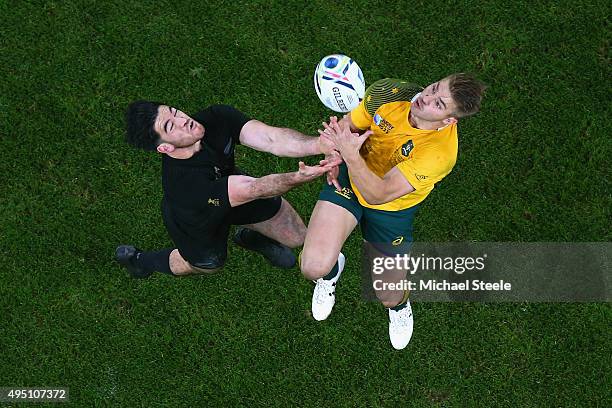 Drew Mitchell of Australia claims the high ball under pressure from Nehe Milner-Skudder of the New Zealand All Blacks during the 2015 Rugby World Cup...