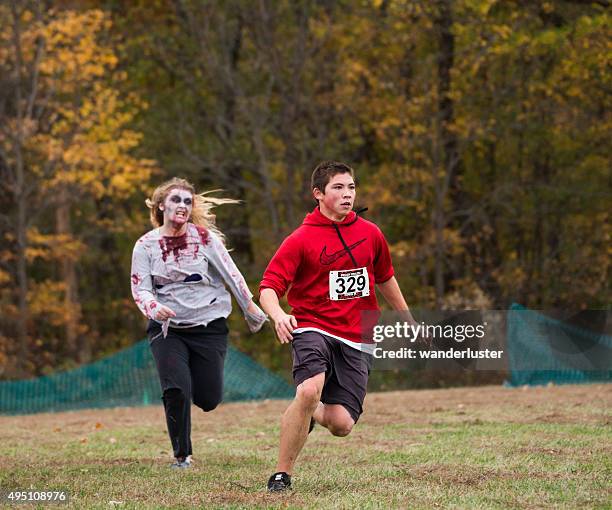 zombie run 5k on halloween - zombie stock pictures, royalty-free photos & images