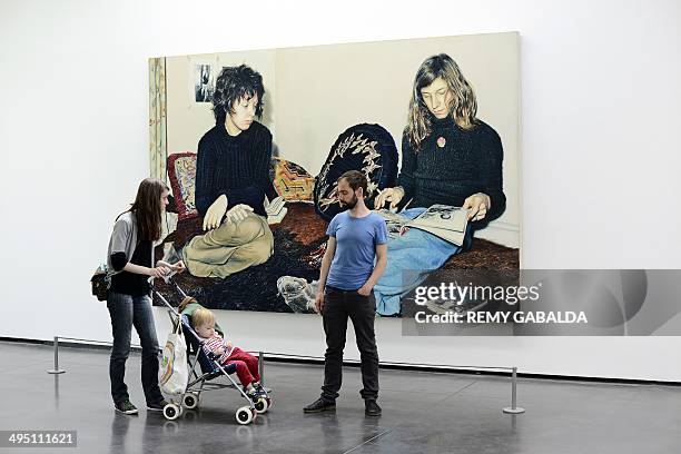 Visitors stand in front of a painting by Swiss artist Franz Gertsch in the Abattoirs Museum in Toulouse, southern France, as part of Toulouse's...