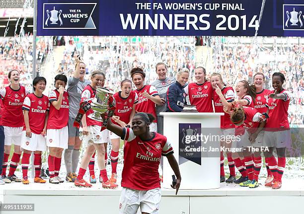 Freda Ayisi of Arsenal Ladies celebrate with the trophy during the FA Women's Cup final between Everton Ladies and Arsenal Ladies at Stadium mk on...