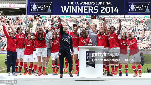 Kelly Smith, Manager of Arsenal Ladies Shelley Kerr and team celebrate with the trophy during the FA Women's Cup final between Everton Ladies and...