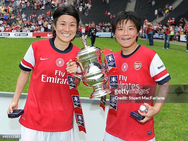 Yukari Kinga and Shinobu Ohno with the FA Cup after Arsenal's win against Everton at Stadium mk on June 1, 2014 in Milton Keynes, England.