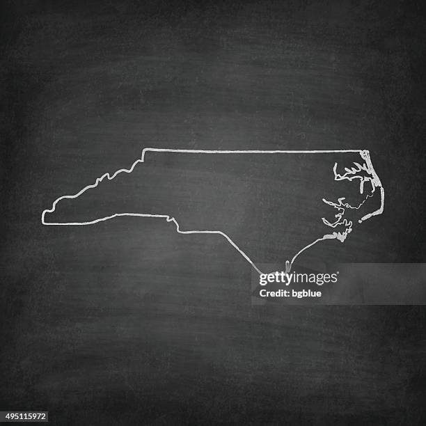 north carolina map on blackboard - chalkboard - raleigh stock illustrations