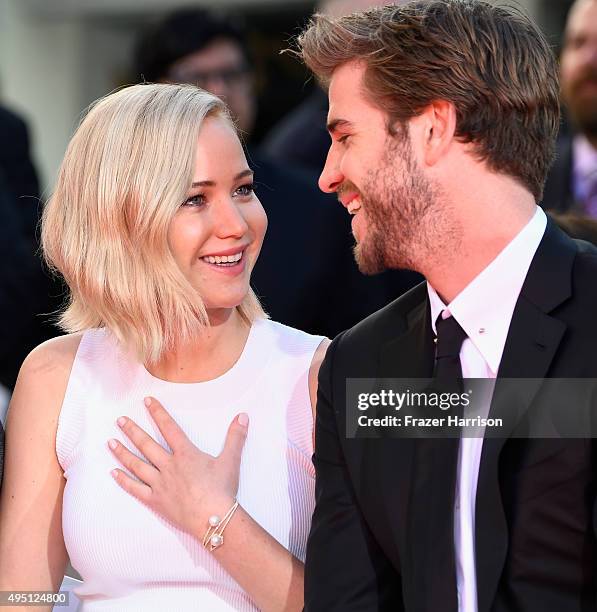 Actors Jennifer Lawrence and Liam Hemsworth attend Lionsgate's "The Hunger Games: Mockingjay - Part 2" Hand and Footprint Ceremony at TCL Chinese...