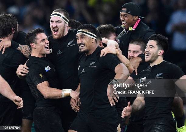 New Zealand's fly half Dan Carter, New Zealand's lock Brodie Retallick, New Zealand's flanker Jerome Kaino and New Zealand's wing Nehe Milner-Skudder...