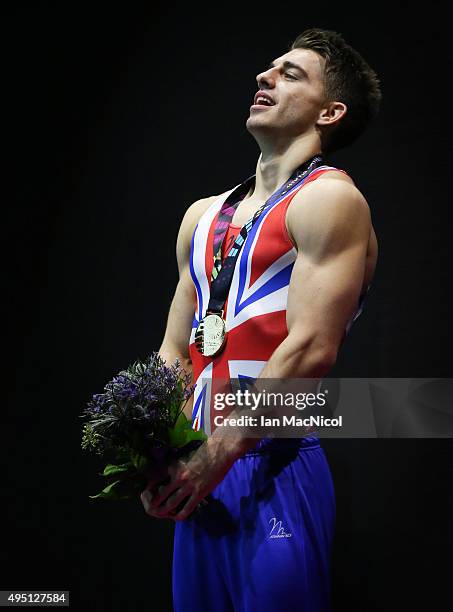 Max Whitlock of Great Britain poses with his gold medal from the pommel during day nine of World Artistic Gymnastics Championships at The SSE Hydro...