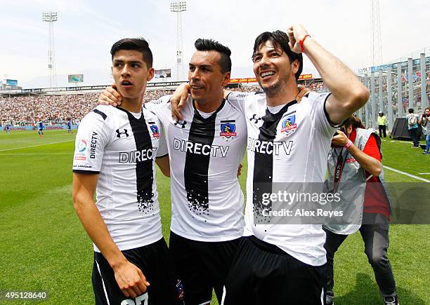 Esteban Paredes of Colo Colo celebrates with teammates after scoring the second goal of his team during a match between Colo Colo and U de Chile as...