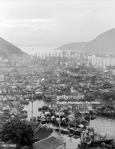 View of the Aberdeen Harbour where many junks are moored. Junks are used by Chinese families both as house and as a transport. Hong Kong, 1961