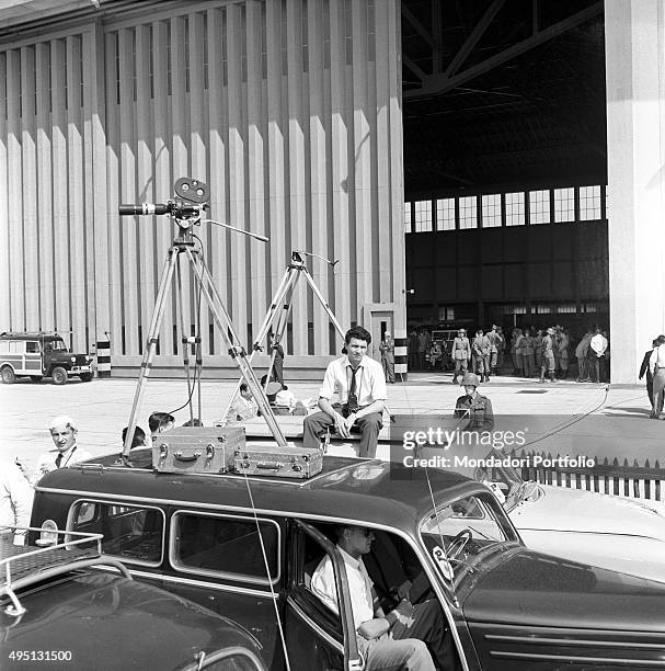 Journalists and Swiss soldiers waiting for the arrival of the authorities at the airport of Geneva during the Summit to discuss global security,...