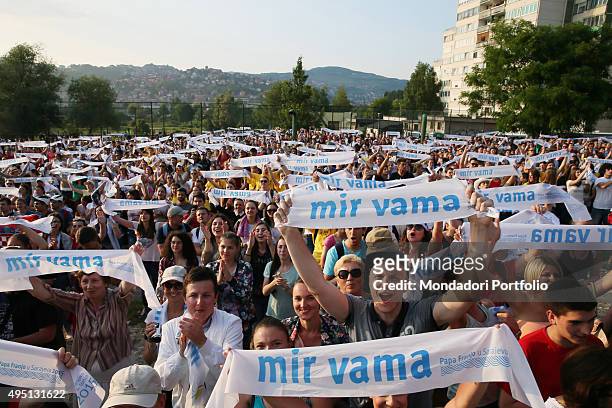 Pope Francis visiting Sarajevo. The Pope meets the youth in John Paul II Centre, waving scarf with the writing Peace May Be With You. Sarajevo, 6th...