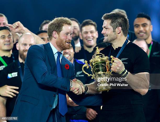 Prince harry presents Richie McCaw of New Zealand with the Webb Ellis Cup during the 2015 Rugby World Cup Final match between New Zealand and...