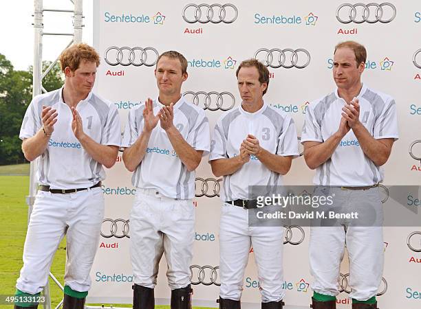 Prince Harry, Mark Tomlinson, Gaston Laulhe and Prince William, Duke of Cambridge attend day two of the Audi Polo Challenge at Coworth Park Polo Club...