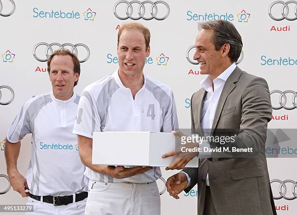 Gaston Laulhe, Prince William, Duke of Cambridge and Andre Konsbruck, Director of Audi UK, attend day two of the Audi Polo Challenge at Coworth Park...