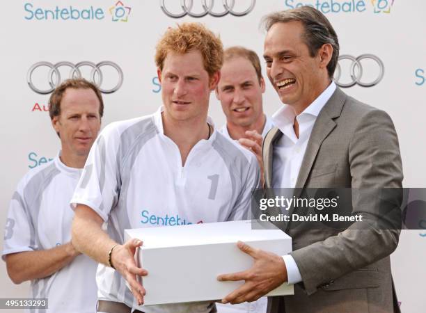 Gaston Laulhe, Prince Harry, Prince William, Duke of Cambridge and Andre Konsbruck, Director of Audi UK, attend day two of the Audi Polo Challenge at...