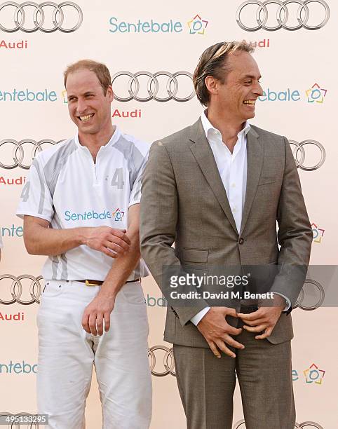 Prince William, Duke of Cambridge, and Andre Konsbruck, Director of Audi UK, attend day two of the Audi Polo Challenge at Coworth Park Polo Club on...