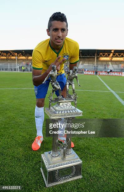 Marquinhos of Brazil celebrates their victory with the trophy during the Final of the Toulon Tournament between France and Brazil at the Parc des...