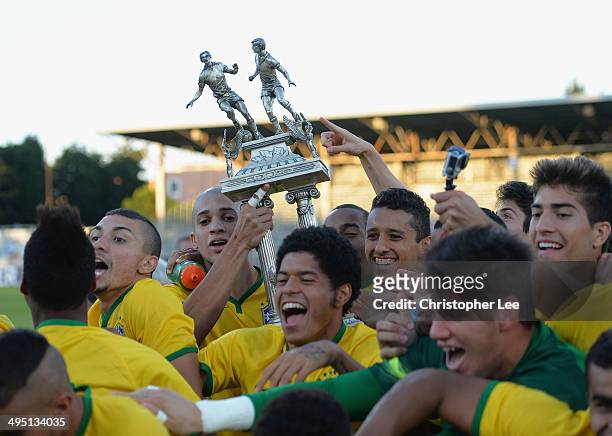 Doria and Marquinhos of Brazil lift the trophy as the rest of Brazil start to celebrate their victory during the Final of the Toulon Tournament...
