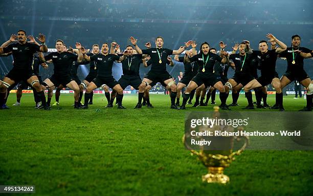 The New Zealand team perform the Haka behind the Webb Ellis Cup to celebrate winning the 2015 Rugby World Cup Final match between New Zealand and...