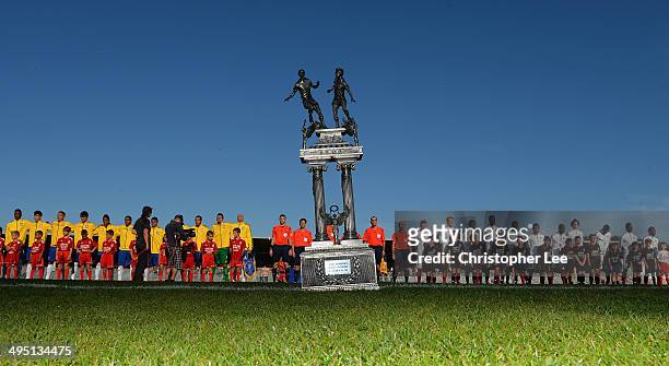 The trophy is seen on the pitch as both teams line up before kick during the Final of the Toulon Tournament between France and Brazil at the Parc des...