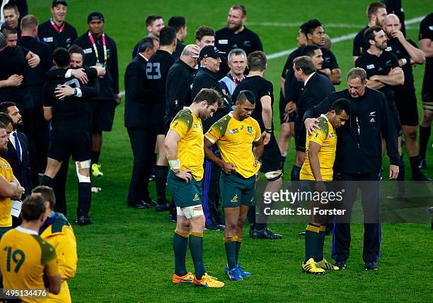 Ben McCalman of Australia, Kurtley Beale of Australia and Will Genia of Australia are dejected following defeat in the 2015 Rugby World Cup Final...