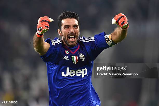 Gianluigi Buffon of Juventus FC celebrates after his team-mate Juan Cuadrado scored the victory goal during the Serie A match between Juventus FC and...