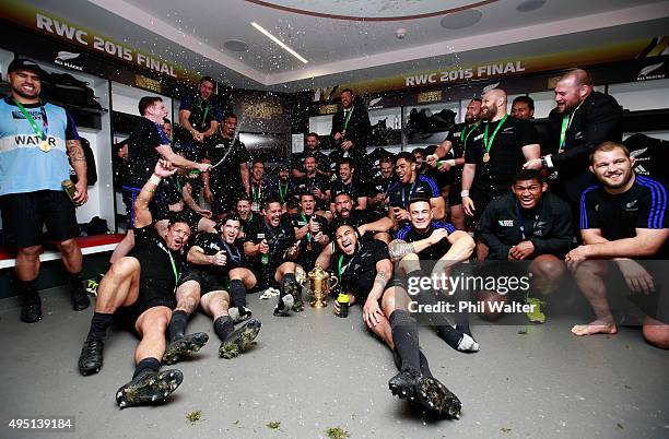 The victorious New Zealand players and staff celebrate in the dressing room after winning the 2015 Rugby World Cup Final match between New Zealand...