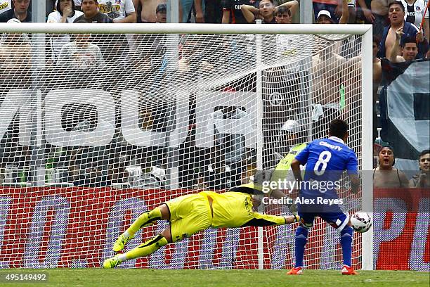 Justo Villar of Colo Colo saves the penalty shot by Patricio Rubio of U de Chile during a match between Colo Colo and U de Chile as part of...