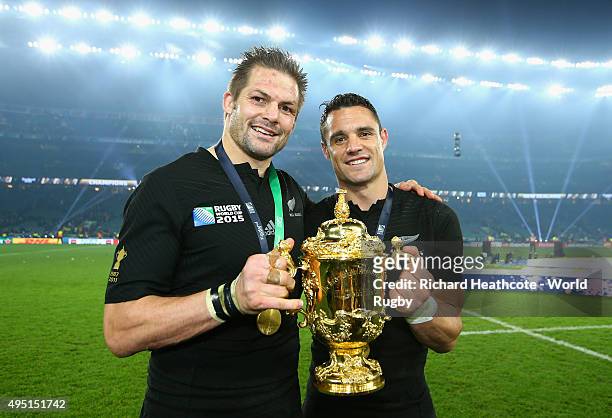 Richie McCaw and Dan Carter of the New Zealand All Blacks poses with the Webb Ellis Cup following the victory against Australia in the 2015 Rugby...