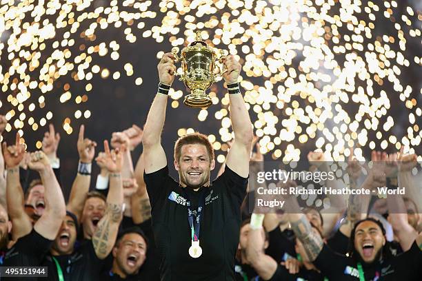 Pyrotechnics explode as Richie McCaw of the New Zealand All Blacks lifts the Webb Ellis Cup following the victory against Australia in the 2015 Rugby...