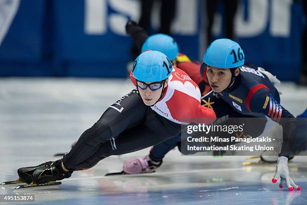 Alexander Fathoullin of Canada competes against Joon Chun Kim of Korea in the 1000 meter quarterfinals on Day 1 of the ISU World Cup Short Track...