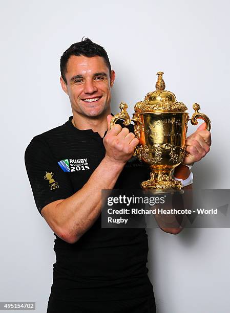 Dan Carter of the New Zealand All Blacks poses with the Webb Ellis Cup after the 2015 Rugby World Cup Final match between New Zealand and Australia...