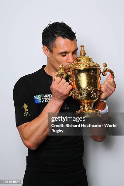 Dan Carter of the New Zealand All Blacks poses with the Webb Ellis Cup after the 2015 Rugby World Cup Final match between New Zealand and Australia...