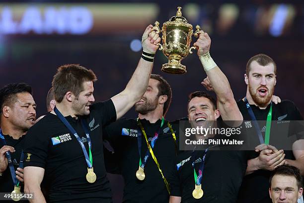 Richie McCaw of New Zealand and Dan Carter of New Zealand hold the Webb Ellis Cup aloft follwoing victory in the 2015 Rugby World Cup Final match...