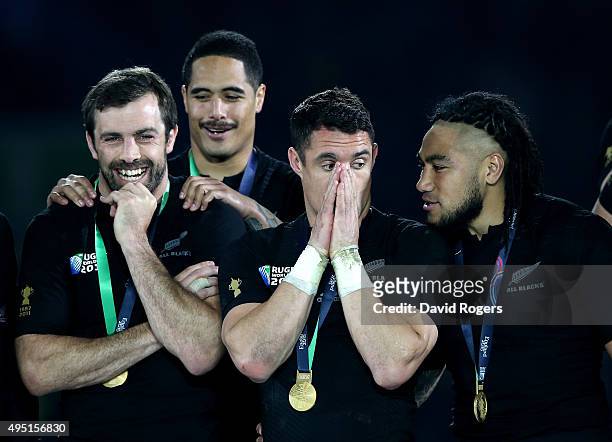 Conrad Smith, Aaron Smith, Dan Carter and Ma'a Nonu of New Zealand celebrate their victory in the 2015 Rugby World Cup Final match between New...