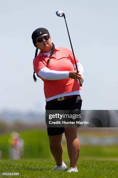 Christina Kim hits her second shot on the third hole during the final round of the ShopRite LPGA Classic presented by Acer on the Bay Course at the...