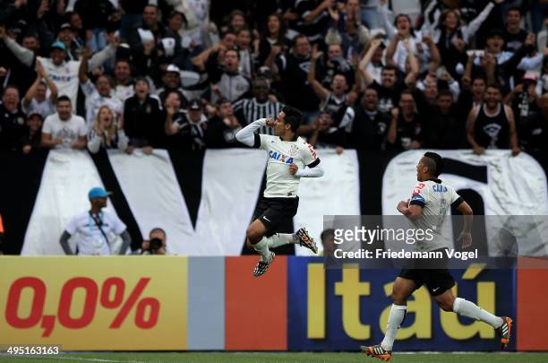 Jadson of Corinthians celebrates scoring the first goal during the match between Corinthians and Botafogo for the Brazilian Series A 2014 at Arena...