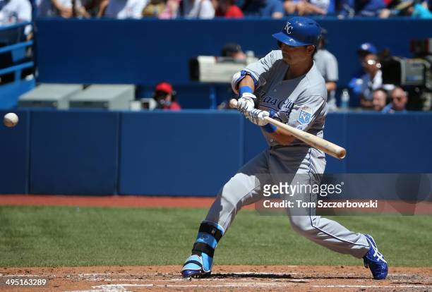 Norichika Aoki of the Kansas City Royals hits a single in the fifth inning during MLB game action against the Toronto Blue Jays on June 1, 2014 at...