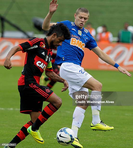 Marlone of Cruzeiro struggles for the ball with Leo Moura of Flamengo during a match between Cruzeiro and Flamengo as part of Brasileirao Series A...