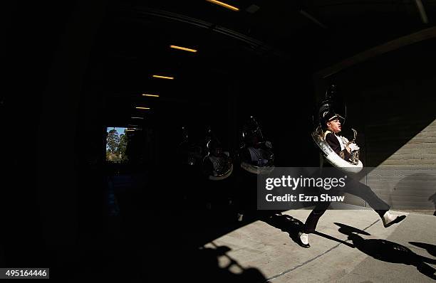 The tuba section of the USC Trojans marching band walks onto the field for their game against the USC Trojans at California Memorial Stadium on...